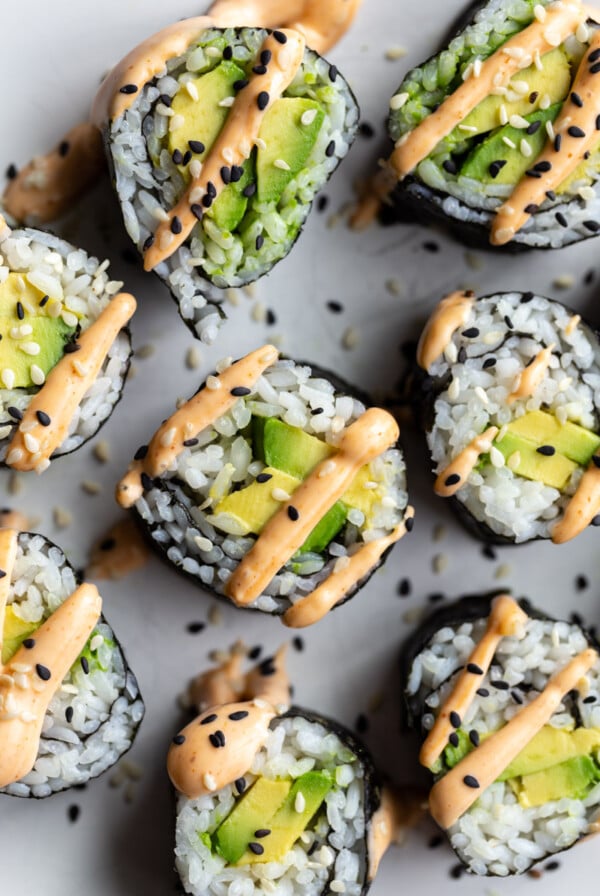 avocado sushi roll topped with spicy mayo