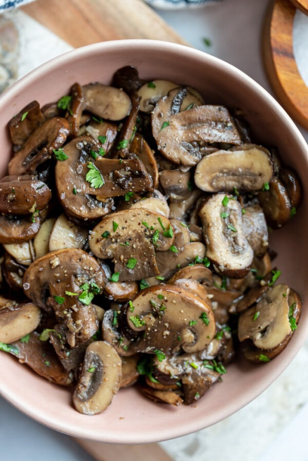 sautéed baby Bella mushrooms served in a small bowl
