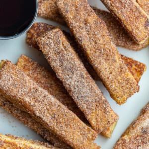 French toast sticks served with maple syrup.