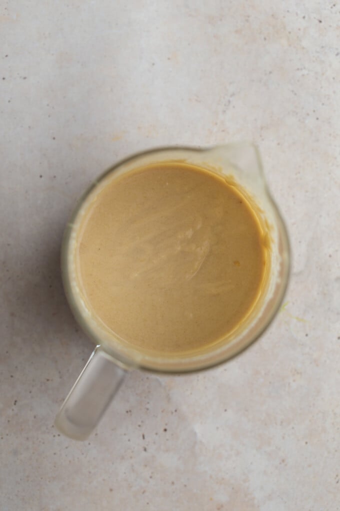 creamy tahini sauce in a glass container