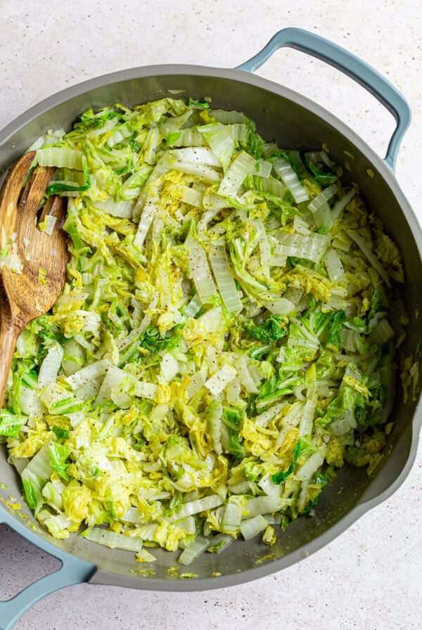 Sautéed Napa cabbage in a large skillet.