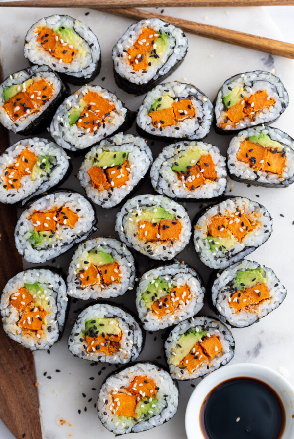 sweet potato sushi on a plate served with soy sauce